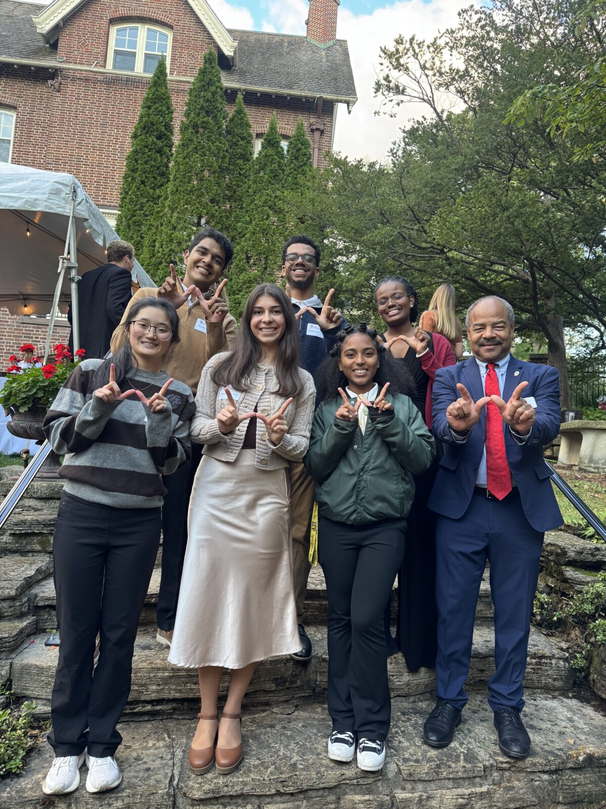 The senior class office poses with interim chancellor Eric Wilcots